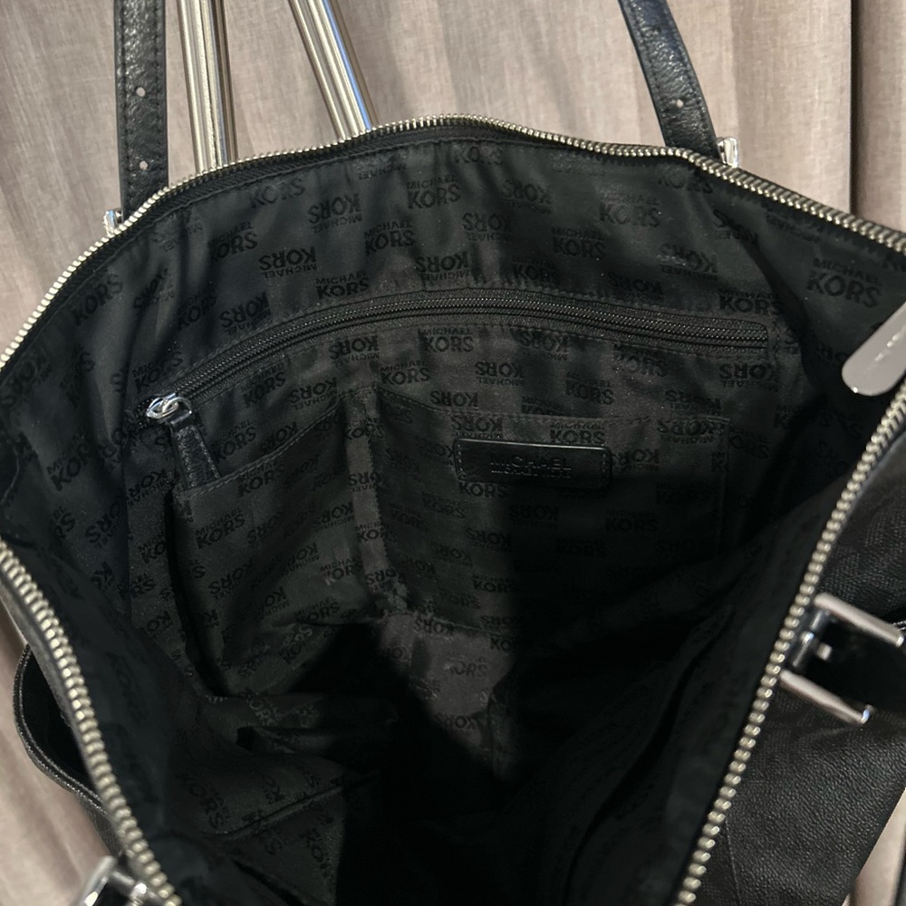 Michael Kors Black Tote Bag with MK logo throughout bag. - Picture 5 of 16